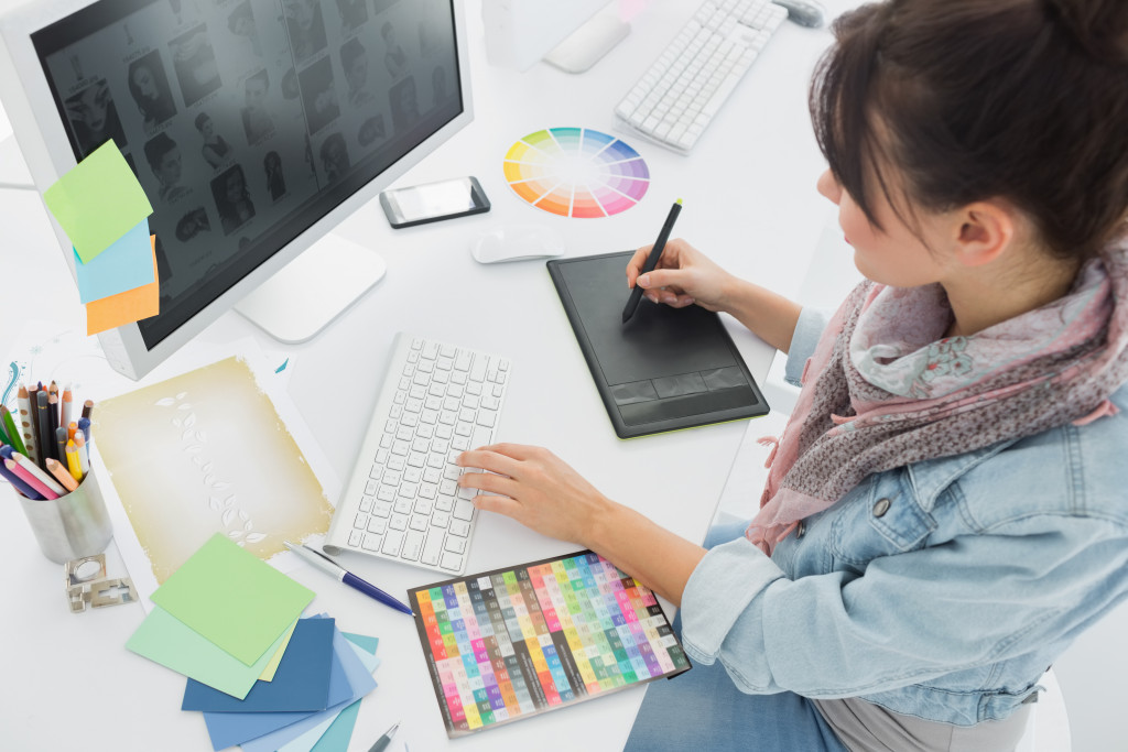 woman making digital art using her computer