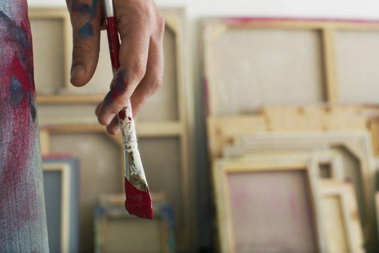 artist holding a paint brush